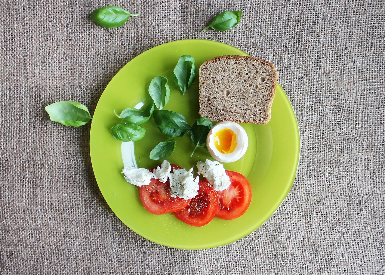 A healthy breakfast plate featuring poached eggs and salmon, illustrating high-quality protein distribution.