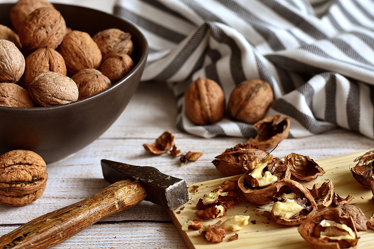 A close-up of Brazil nuts in a small wooden bowl, emphasizing micronutrient density.