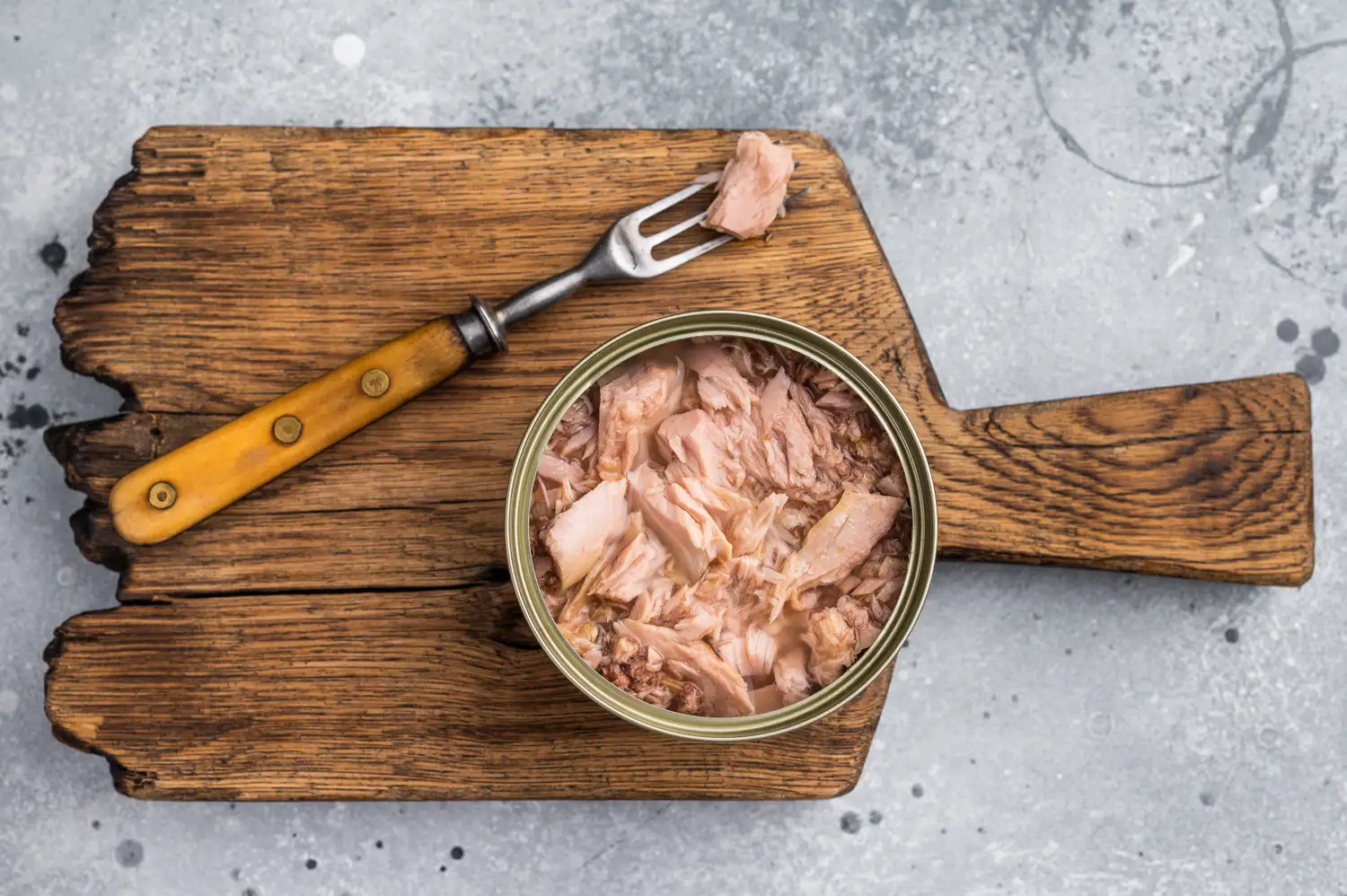 Canned tuna in a bowl prepared for a meal.