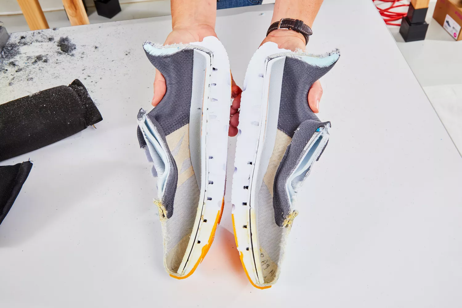 A cross-section of a running shoe showing the internal foam layers and cushioning structure.