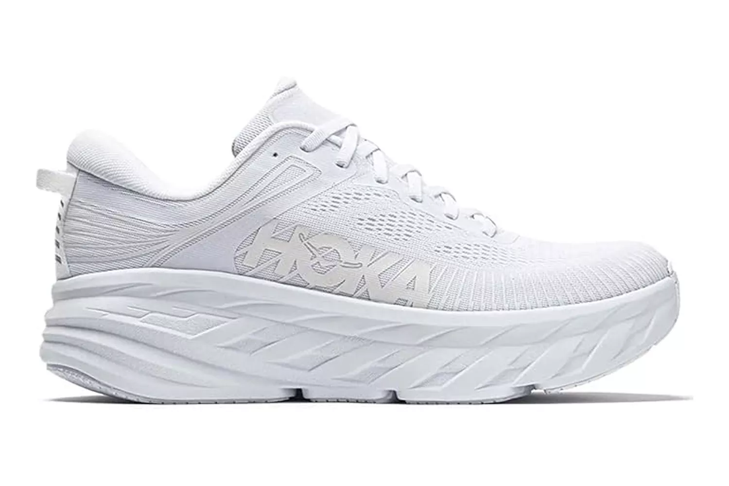 Side profile of a white Hoka Bondi running shoe highlighting its thick cushioned sole.
