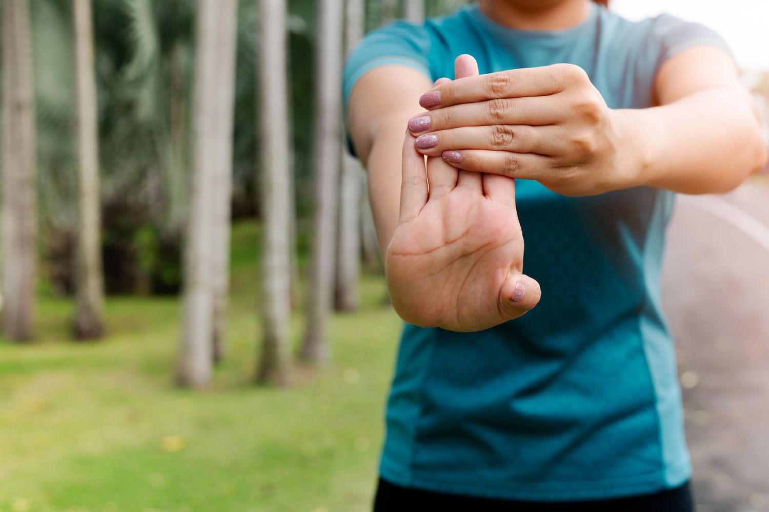 Close-up of a lifter's wrist showing neutral alignment for joint stability.