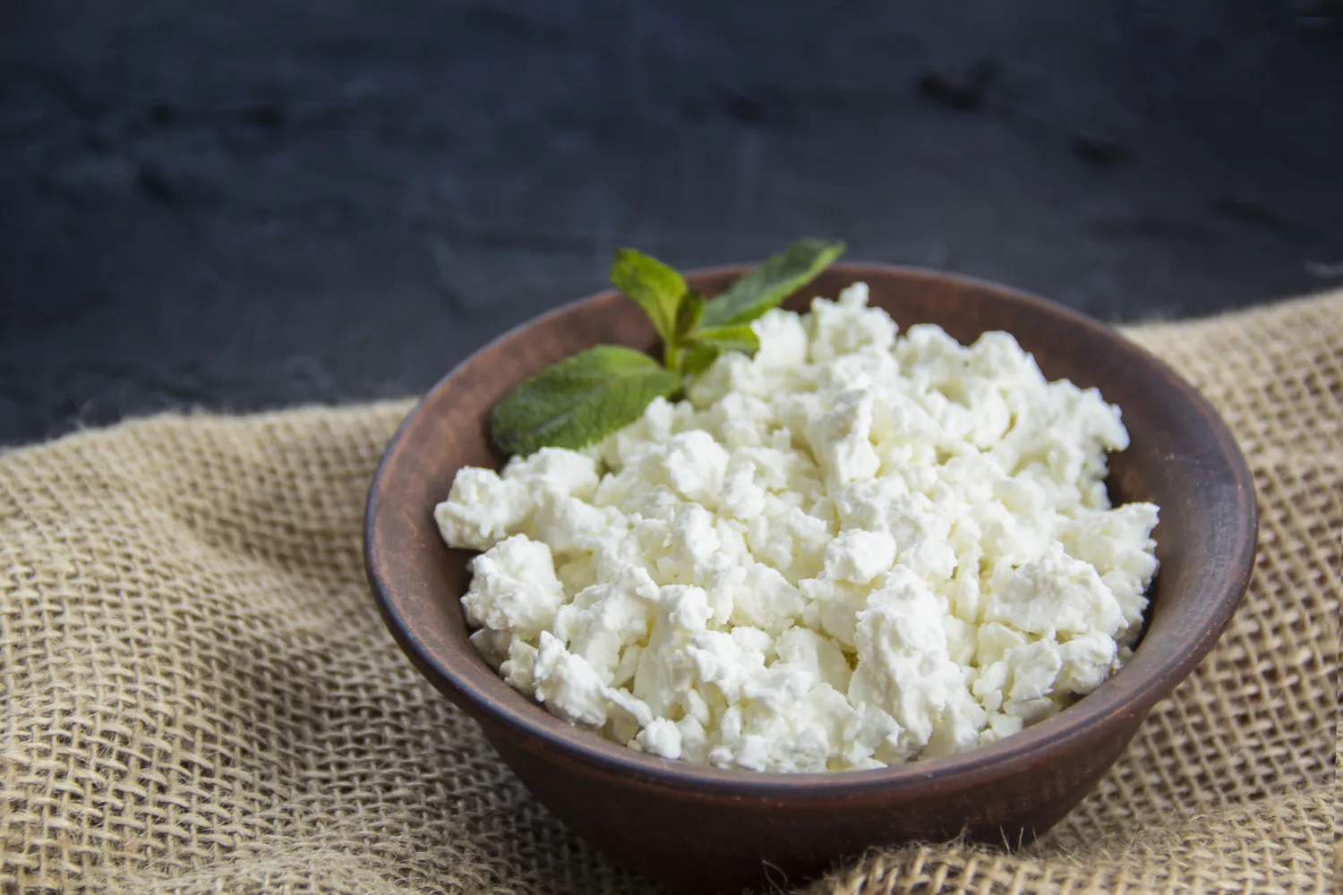 A bowl of cottage cheese viewed from above.