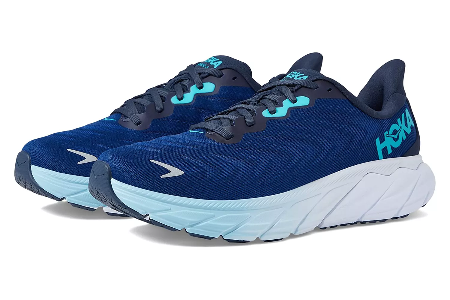 Navy blue and teal Hoka Arahi 6 running shoes, illustrating a lightweight stability design for overpronators.