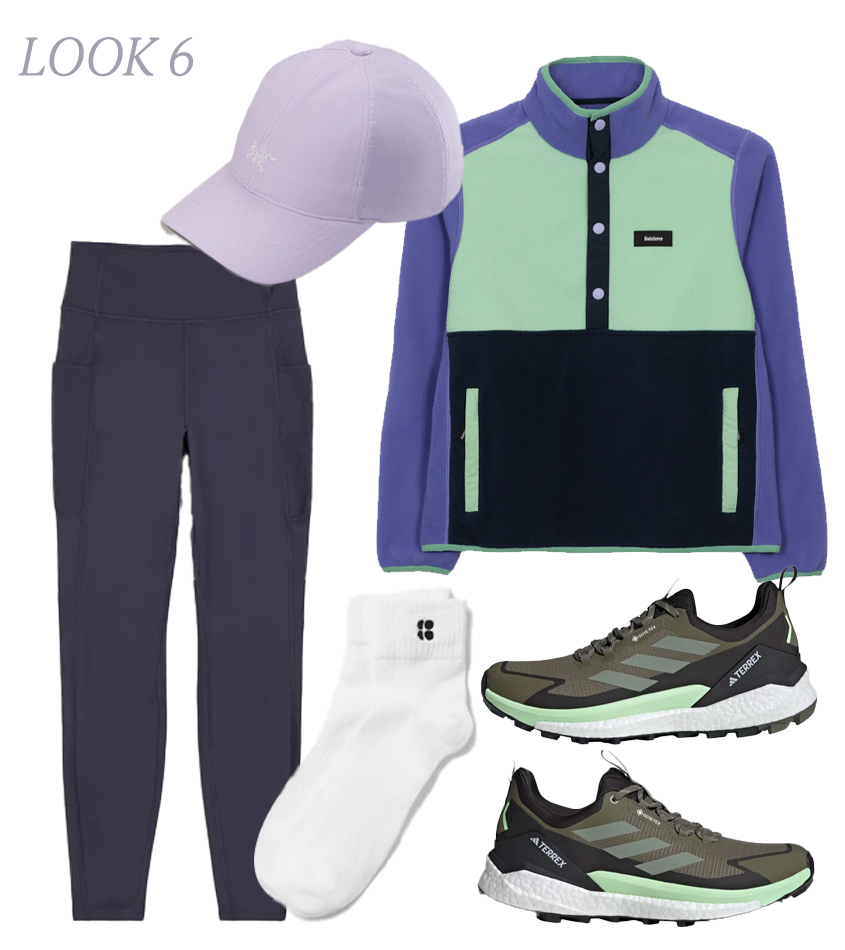 A runner in a lightweight, breathable windbreaker on an outdoor path.
