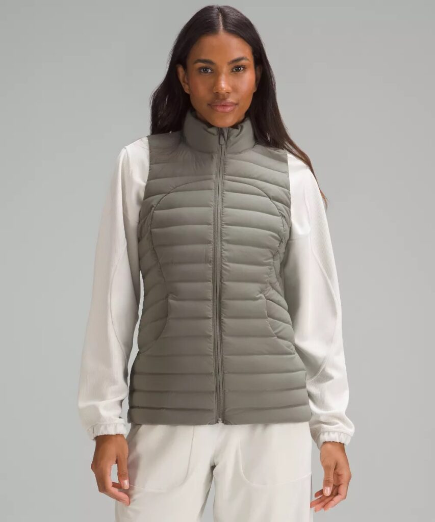 A sage green lightweight down-filled fitness vest.