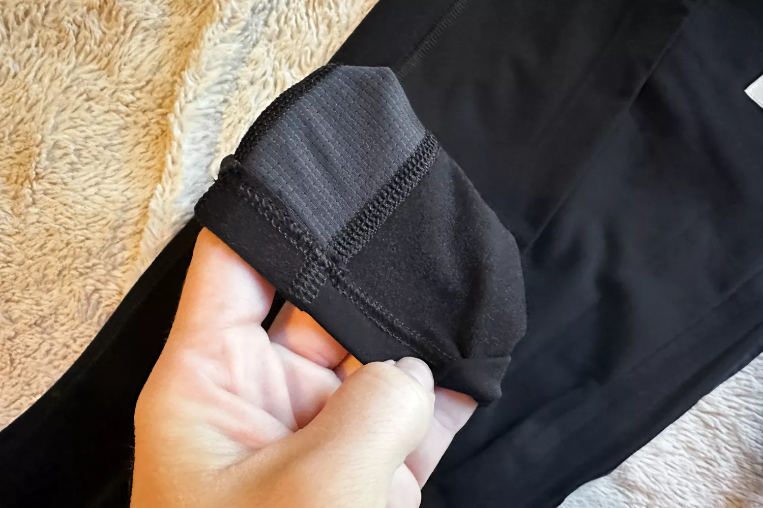 Close-up of the textured inner lining of black athletic leggings.