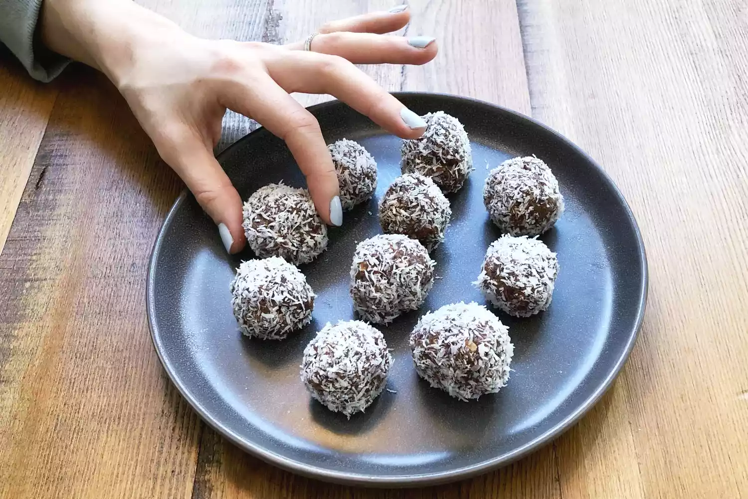 Homemade energy bites made with figs and oats on a tray.