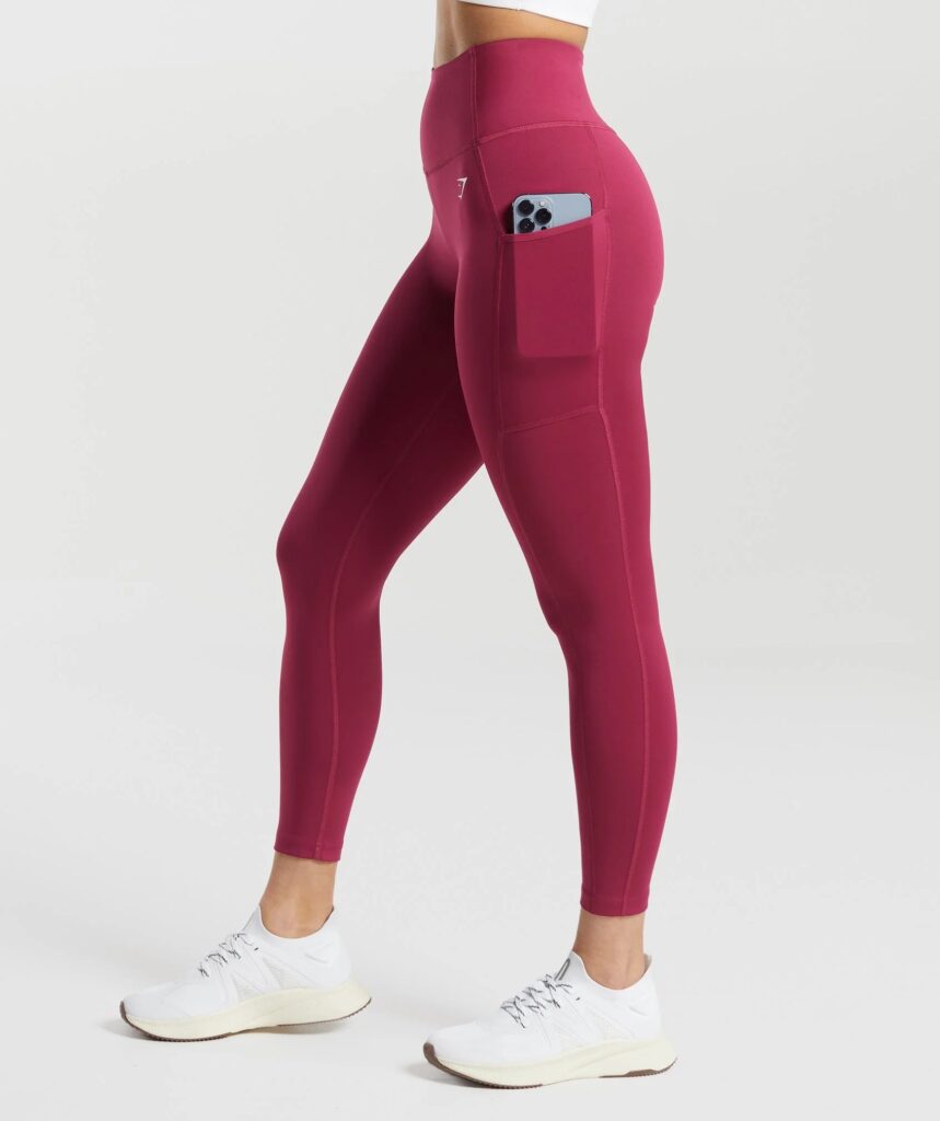 Gymshark running leggings with side pockets in a bright colorway.