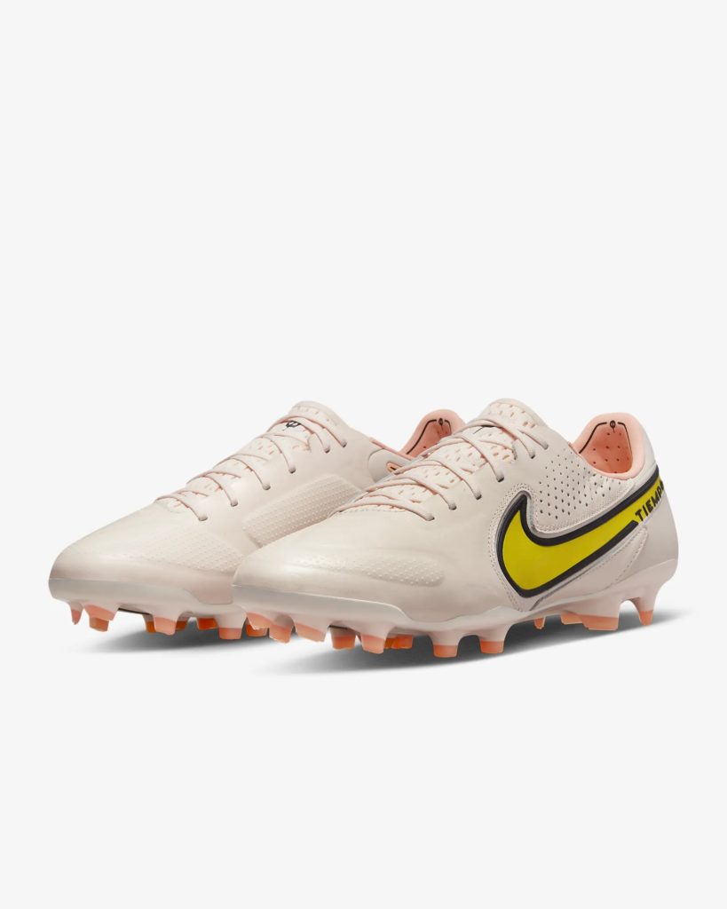 A pair of white and blue Nike Tiempo Legend football boots.