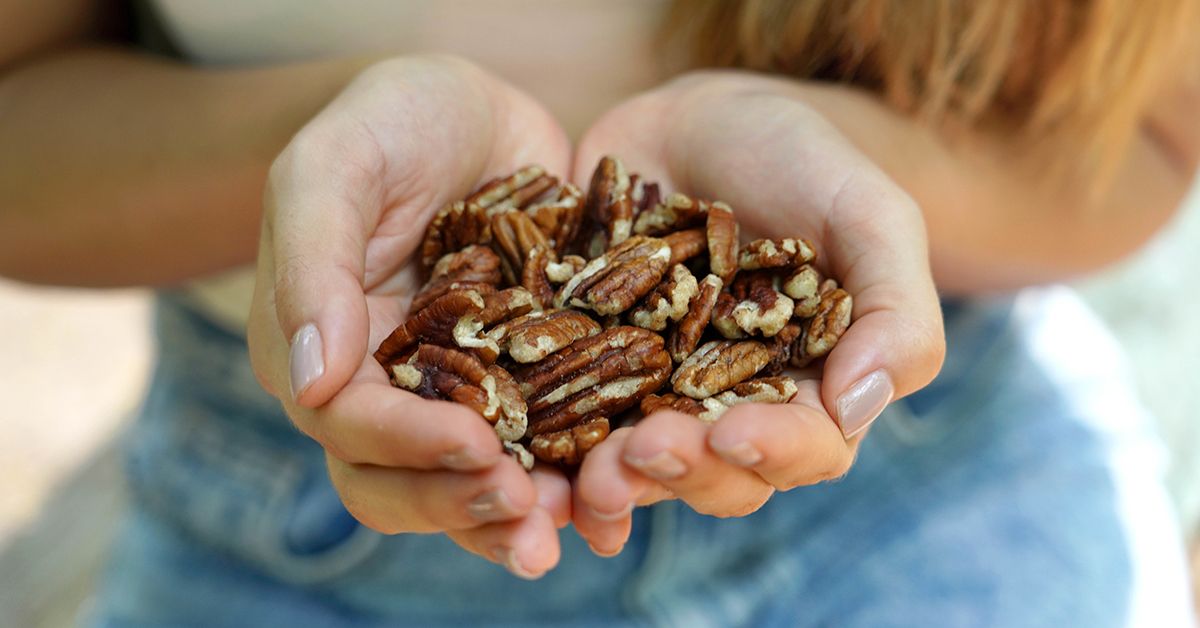 Shelled pecans displaying their intricate texture and rich brown color.