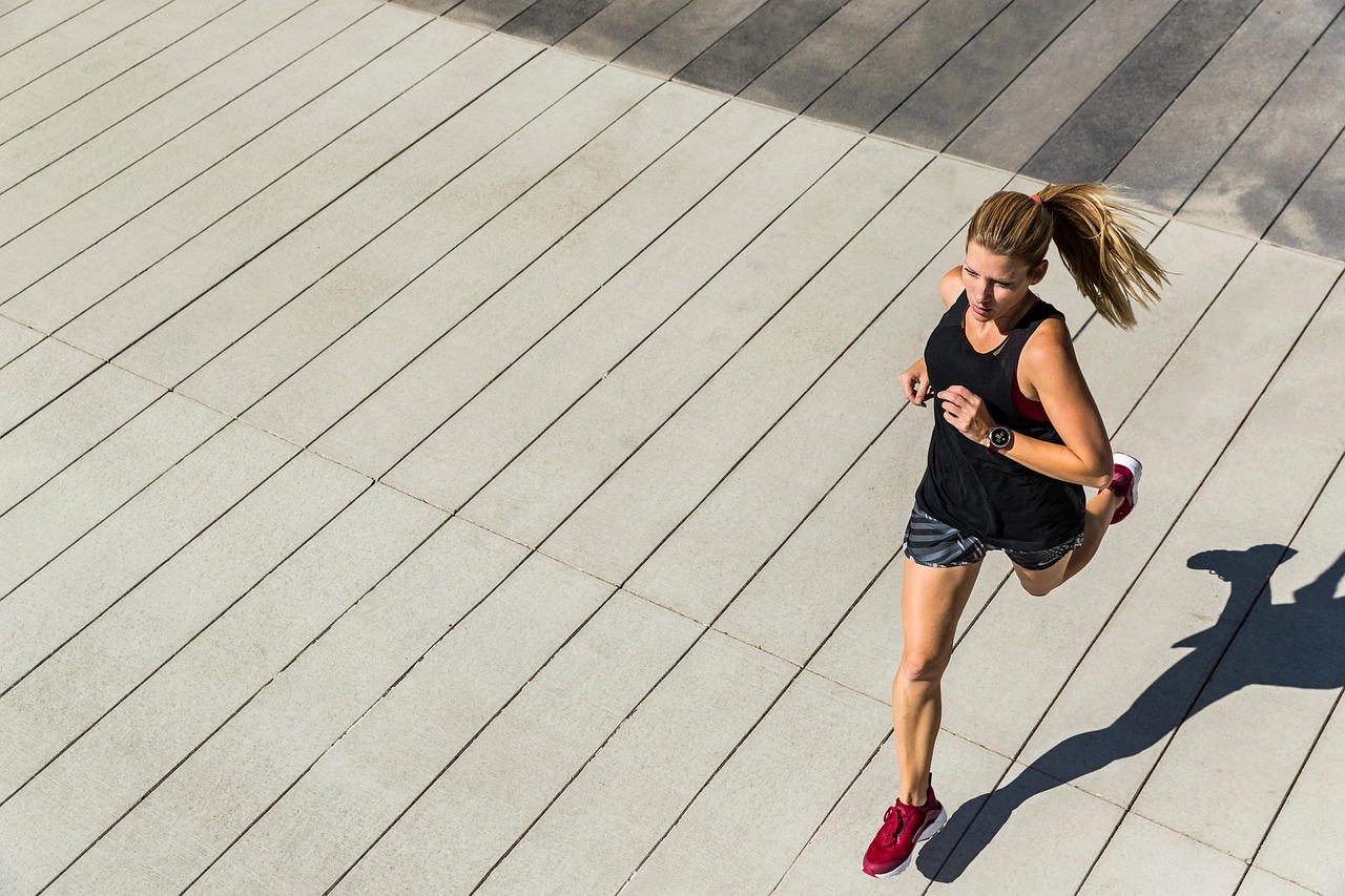 An athlete running outdoors during a bright sunrise representing energy
